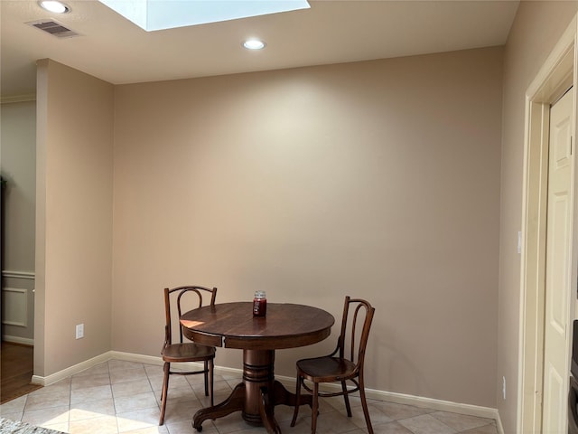 3923 Fordham Park Ct, Pasadena, TX 77058 - dining room featuring a skylight, recessed lighting, light tile patterned flooring, and baseboards