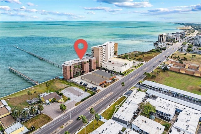 aerial view of property's location featuring a large body of water and nearby urban area