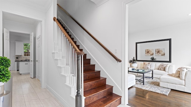 stairs with crown molding