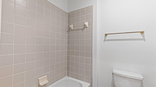 bathroom featuring toilet and tub / shower combination