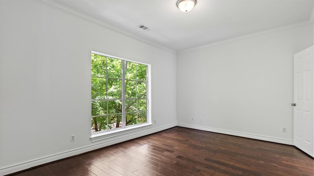 unfurnished room with crown molding, dark wood-type flooring, and baseboards