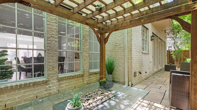 view of patio / terrace featuring a pergola, fence, and central AC unit