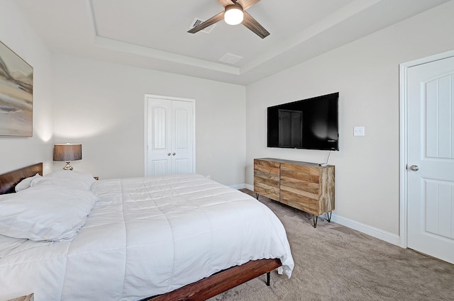 8207 Oxbow Manor Ln, Cypress, TX 77433 - carpeted bedroom with a tray ceiling, baseboards, and ceiling fan