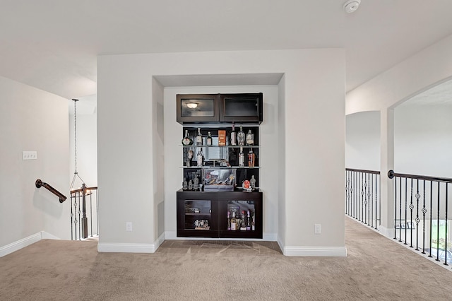 8207 Oxbow Manor Ln, Cypress, TX 77433 - corridor featuring carpet flooring, baseboards, arched walkways, and an upstairs landing