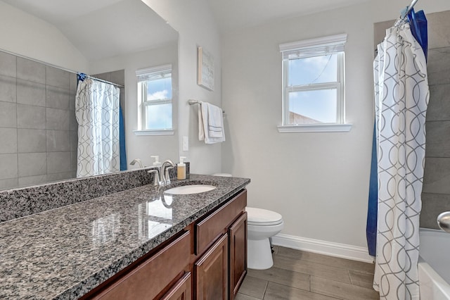 8207 Oxbow Manor Ln, Cypress, TX 77433 - full bath featuring toilet, vanity, baseboards, and shower / bathtub combination with curtain