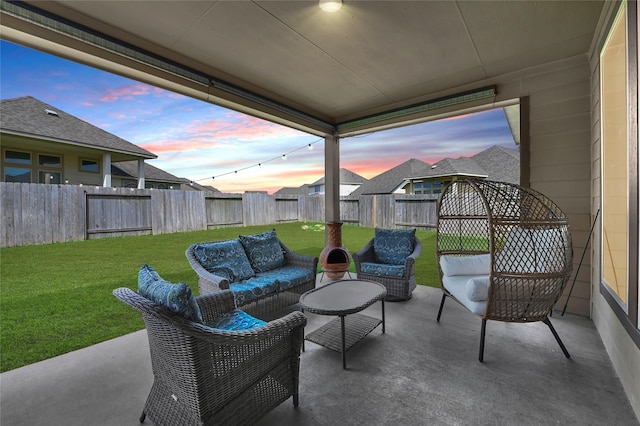 8207 Oxbow Manor Ln, Cypress, TX 77433 - patio terrace at dusk featuring outdoor lounge area