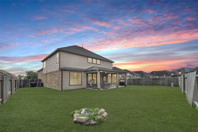 8207 Oxbow Manor Ln, Cypress, TX 77433 - back of property featuring an outdoor living space, central AC, brick siding, and a patio