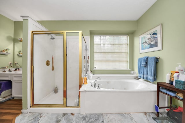 bathroom with a whirlpool tub and a stall shower
