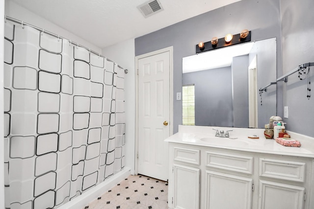 full bathroom with a shower with shower curtain and vanity