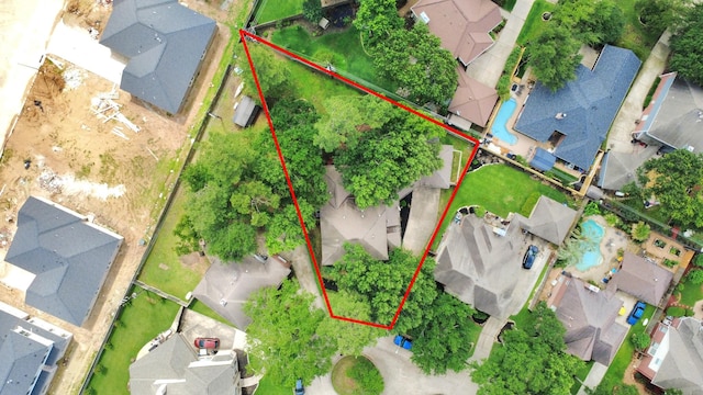 aerial perspective of suburban area featuring property boundaries highlighted