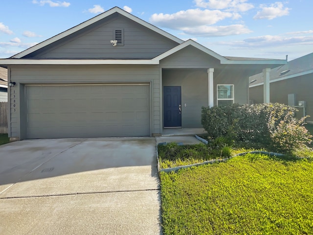 view of front facade with driveway and an attached garage