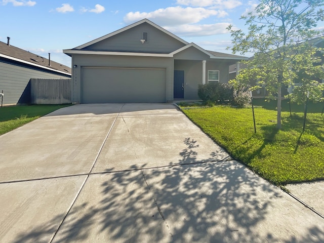 ranch-style home with driveway and an attached garage
