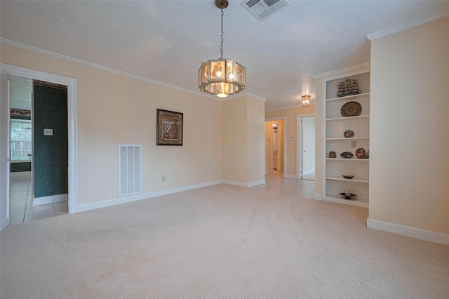 unfurnished room featuring light carpet, a chandelier, crown molding, baseboards, and a textured ceiling