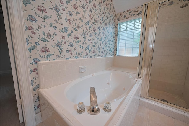 bathroom featuring wallpapered walls, a stall shower, tile patterned flooring, and a tub with jets