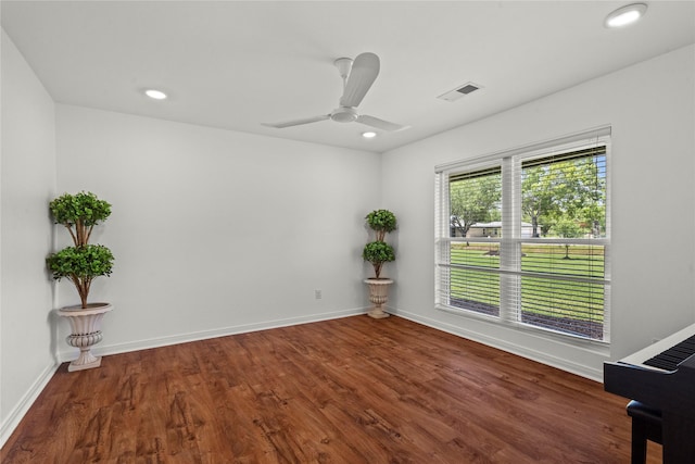 spare room with wood finished floors, baseboards, a ceiling fan, and recessed lighting