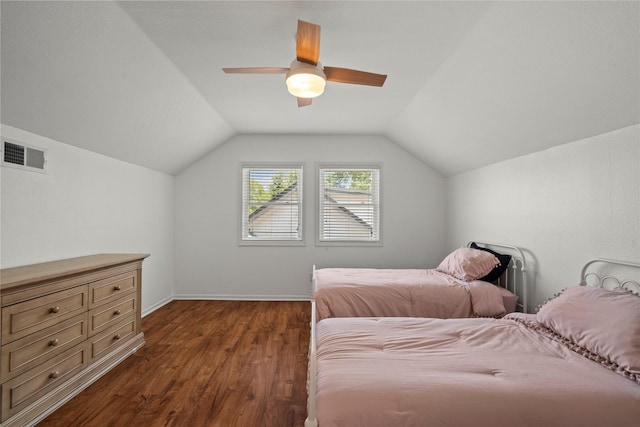 bedroom with dark wood finished floors, lofted ceiling, a ceiling fan, and baseboards