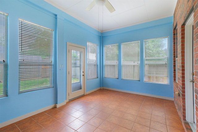 2835 Chalet Knolls Ln, Katy, TX 77494 - tiled empty room featuring plenty of natural light, a ceiling fan, and baseboards
