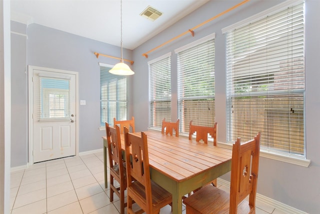 2835 Chalet Knolls Ln, Katy, TX 77494 - dining room featuring healthy amount of natural light, light tile patterned floors, and baseboards