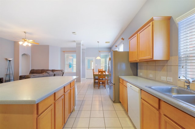 2835 Chalet Knolls Ln, Katy, TX 77494 - kitchen featuring dishwasher, a sink, light tile patterned floors, freestanding refrigerator, and open floor plan