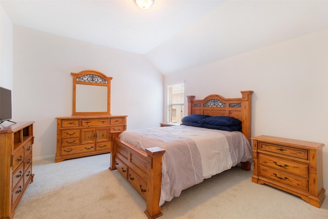 2835 Chalet Knolls Ln, Katy, TX 77494 - bedroom featuring light colored carpet, lofted ceiling, and baseboards