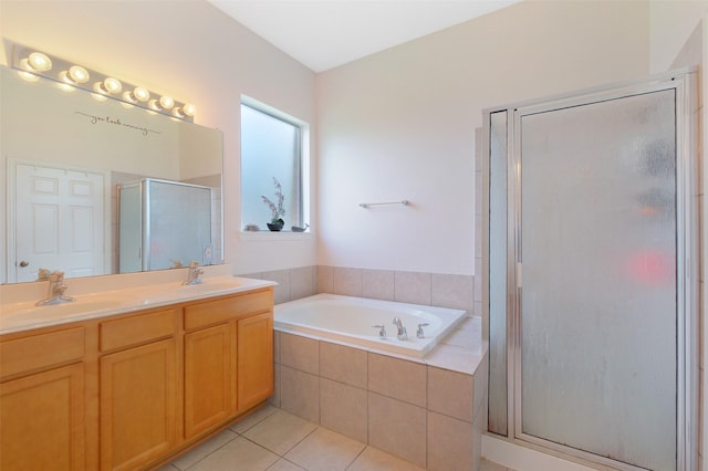 2835 Chalet Knolls Ln, Katy, TX 77494 - bathroom featuring a garden tub, tile patterned floors, a shower stall, and double vanity