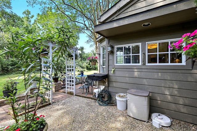 view of side of property featuring a patio area