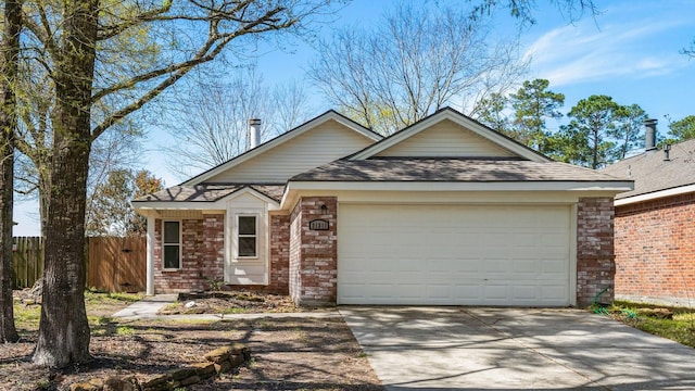 31311 N Head Dr, Spring, TX 77386 - ranch-style house with a garage, concrete driveway, fence, brick siding, and a shingled roof
