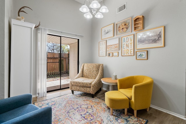31311 N Head Dr, Spring, TX 77386 - living area featuring wood finished floors, baseboards, a chandelier, and a high ceiling
