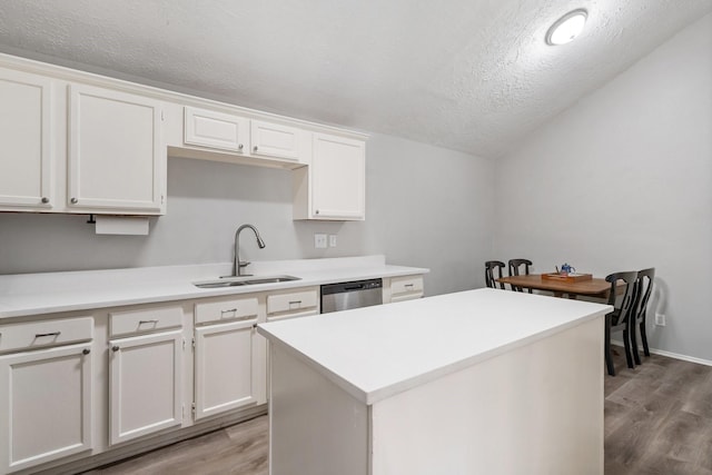 31311 N Head Dr, Spring, TX 77386 - kitchen with a sink, dishwasher, light wood-type flooring, a textured ceiling, and white cabinets
