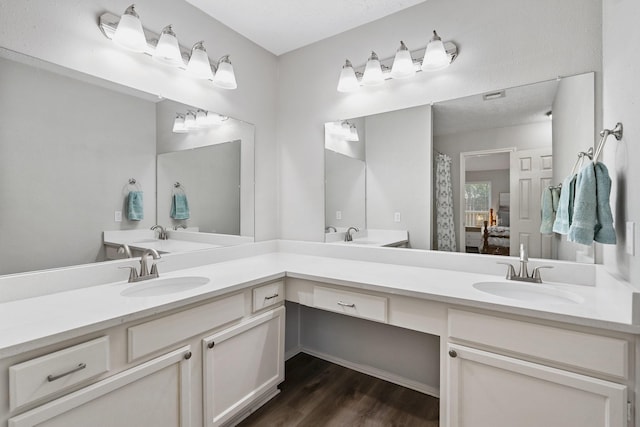 31311 N Head Dr, Spring, TX 77386 - ensuite bathroom with wood finished floors and double vanity
