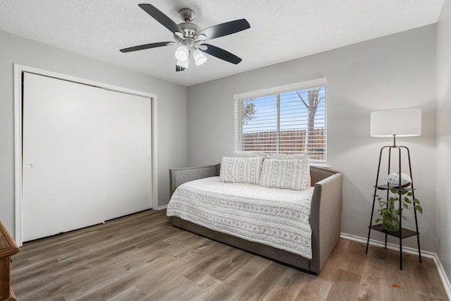 31311 N Head Dr, Spring, TX 77386 - bedroom featuring wood finished floors, a closet, ceiling fan, and baseboards
