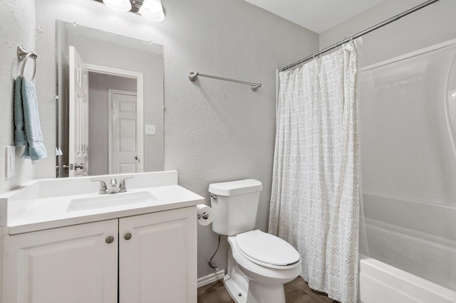 31311 N Head Dr, Spring, TX 77386 - bathroom with a textured wall, toilet, vanity, shower / tub combo with curtain, and wood finished floors