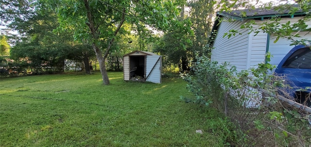 10341 Caxton St, Houston, TX 77016 - view of grassy yard with a storage unit and an outdoor structure