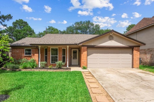 ranch-style home with brick siding, driveway, a front yard, an attached garage, and roof with shingles