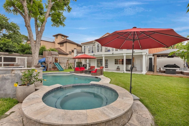 view of swimming pool featuring an outdoor hangout area, a patio area, and a playground