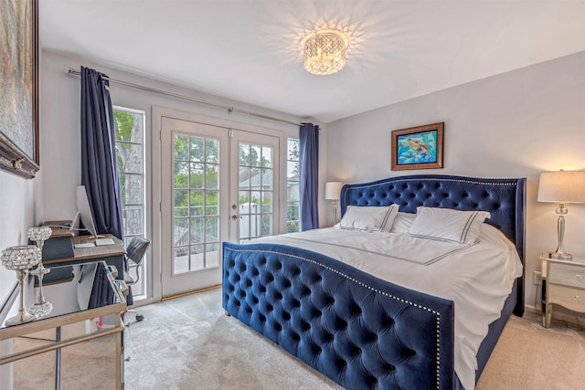 bedroom featuring light colored carpet, access to exterior, and french doors