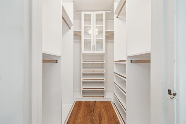 spacious closet with wood finished floors