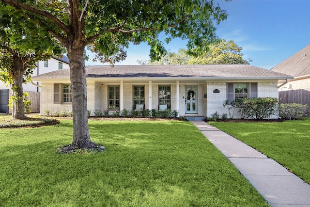 single story home with brick siding and a shingled roof