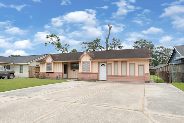 7434 Langley Rd, Houston, TX 77016 - ranch-style home featuring board and batten siding, brick siding, concrete driveway, and a shingled roof