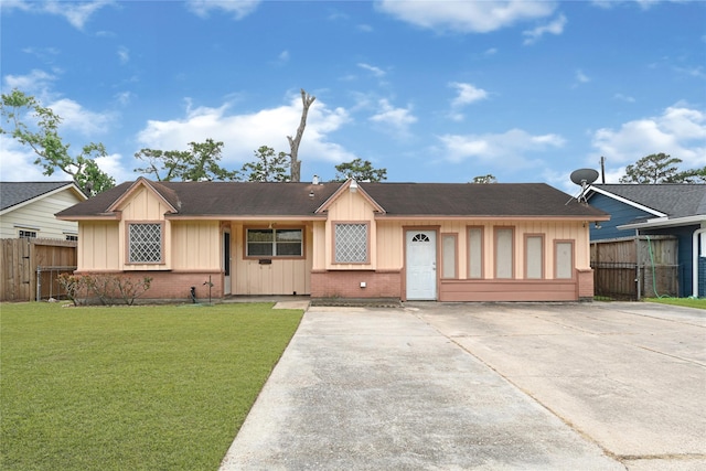 7434 Langley Rd, Houston, TX 77016 - ranch-style home with board and batten siding, a shingled roof, and brick siding