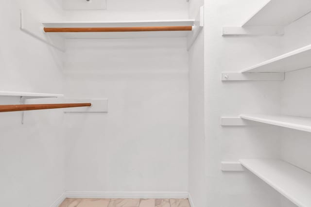 2815 Panagard Dr Unit 38, Houston, TX 77082 - spacious closet featuring light marble finish flooring