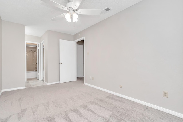 2815 Panagard Dr Unit 38, Houston, TX 77082 - unfurnished bedroom featuring carpet, baseboards, connected bathroom, and ceiling fan