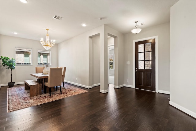foyer with a chandelier, hardwood / wood-style floors, baseboards, and recessed lighting