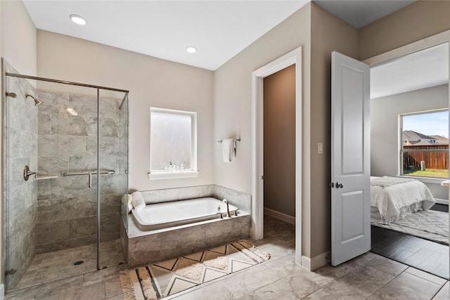 full bathroom featuring a stall shower, ensuite bathroom, a bath, baseboards, and recessed lighting