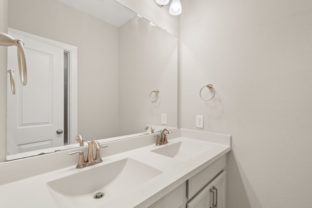 bathroom featuring double vanity