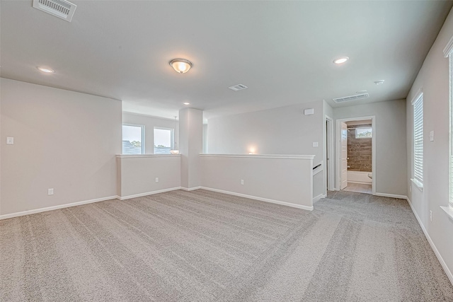 27322 Axis Deer Trl, Magnolia, TX 77354 - carpeted spare room featuring healthy amount of natural light, recessed lighting, and baseboards