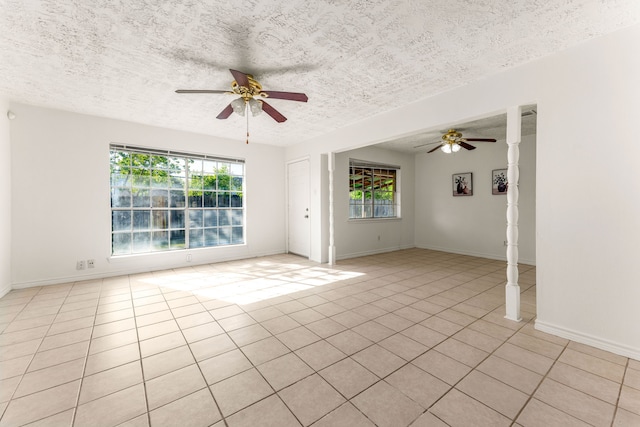 10431 Sagewillow Ln, Houston, TX 77089 - spare room featuring a ceiling fan, plenty of natural light, a textured ceiling, and light tile patterned flooring