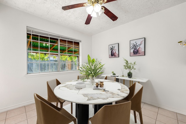 10431 Sagewillow Ln, Houston, TX 77089 - dining area with a ceiling fan, light tile patterned floors, a textured ceiling, and baseboards