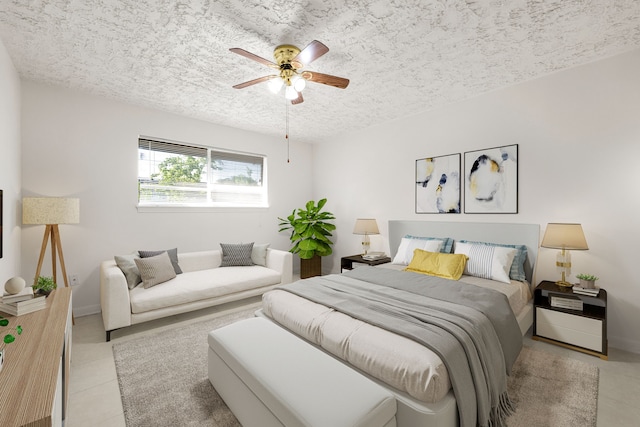 10431 Sagewillow Ln, Houston, TX 77089 - bedroom with a textured ceiling, a ceiling fan, light tile patterned floors, and baseboards