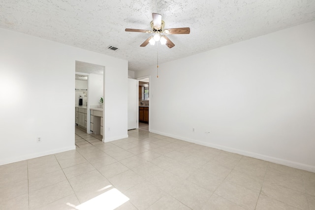 10431 Sagewillow Ln, Houston, TX 77089 - spare room with a ceiling fan, a textured ceiling, and baseboards